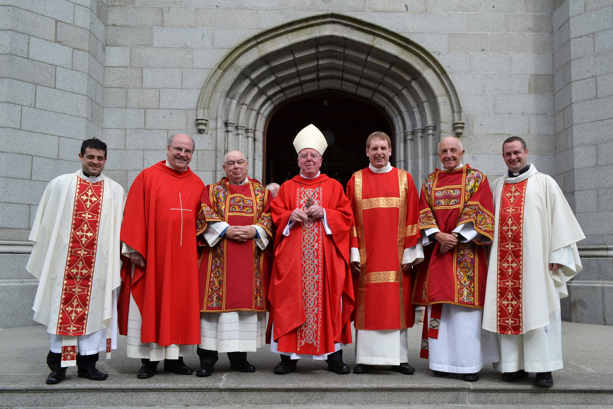 Bishop McAreavey with Deacon McClelland and Deacon Rooney and local clergy at ordination